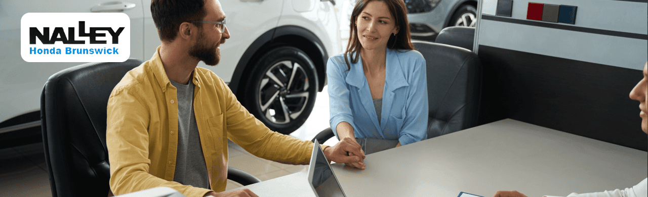 Customer reviewing a MAX Allowance offer compared to Carvana at Nalley Honda Brunswick.