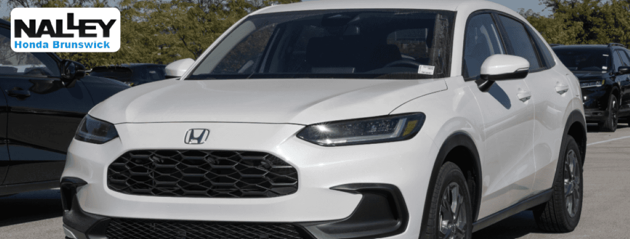 A wide lineup of affordable used vehicles on display at Nalley Honda Brunswick dealership.
