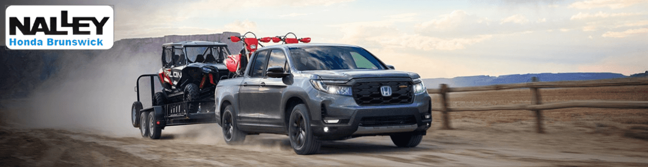 Honda Ridgeline parked at Nalley Honda Brunswick, showcasing its rugged yet refined exterior.