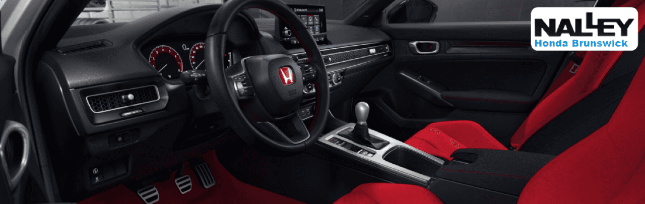 Interior shot of the Honda Civic showing advanced technology and safety features available at Nalley Honda Brunswick.