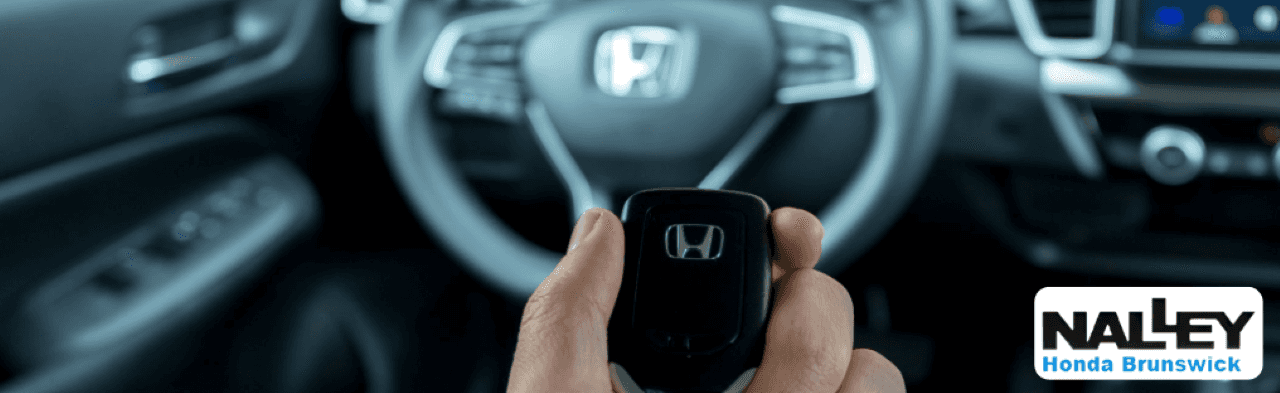 Interior of a Honda Pilot featuring all-weather floor mats, tech package, and cargo accessories ideal for families in Brunswick.