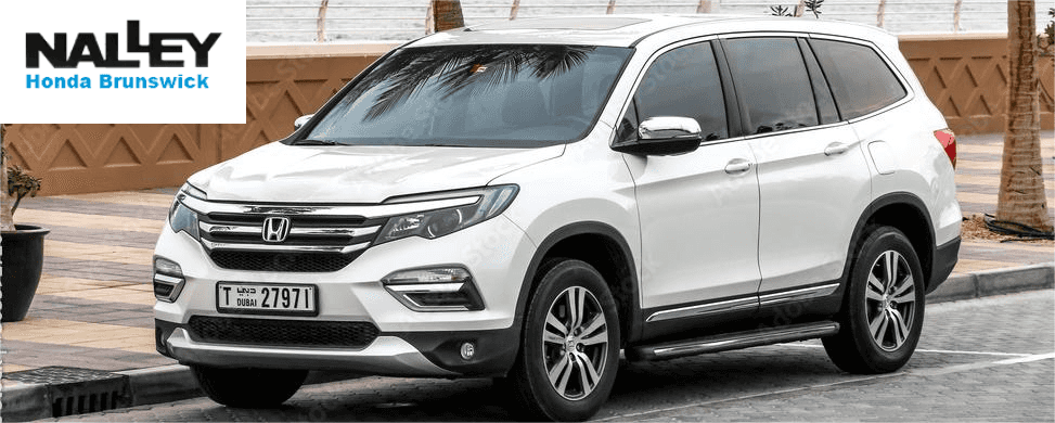 Used Honda Pilot SUV exterior parked in a Brunswick, Georgia dealership lot