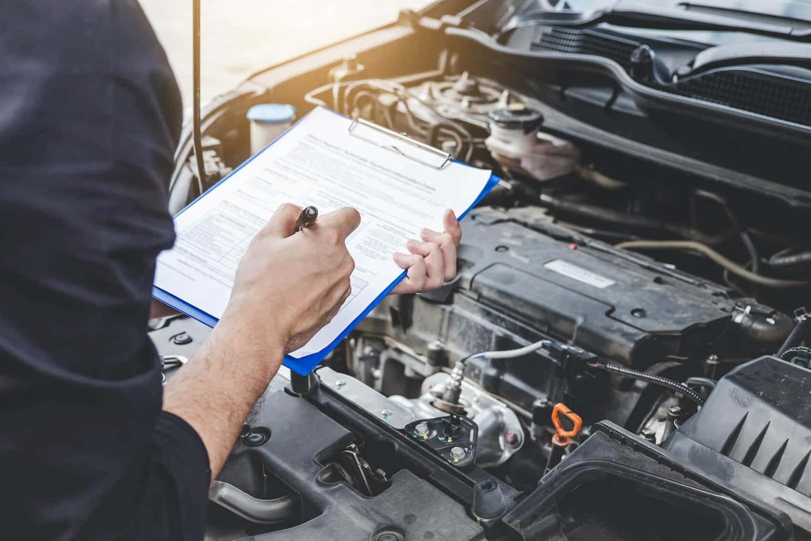 A technicians performing a multi-point inspection
