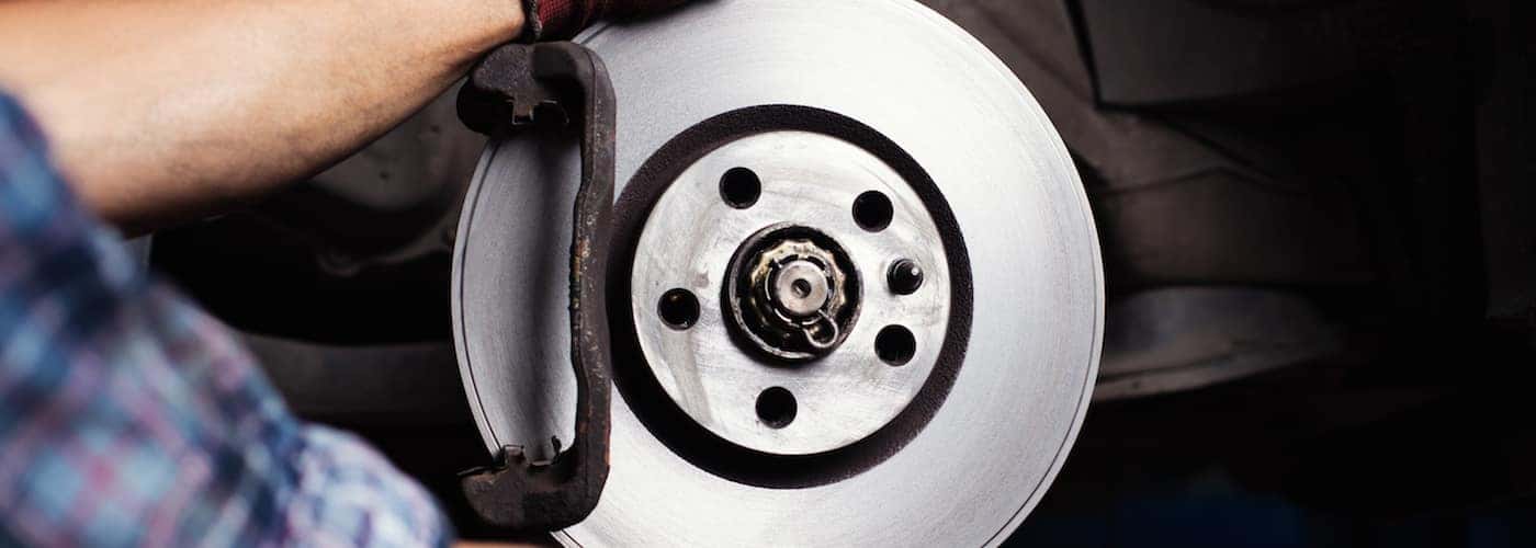 Mechanic Working on Brakes