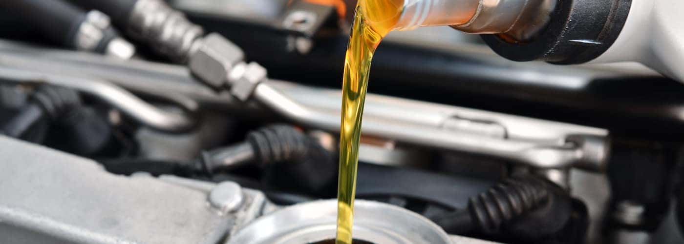 Pouring Oil Into Reservoir