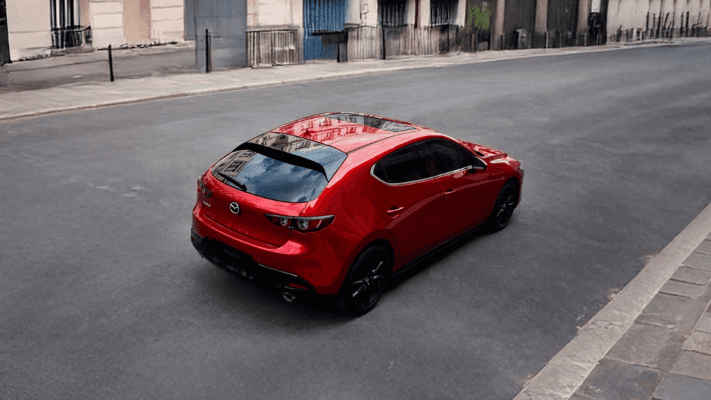 Red 2026 Mazda3 Hatchback Driving