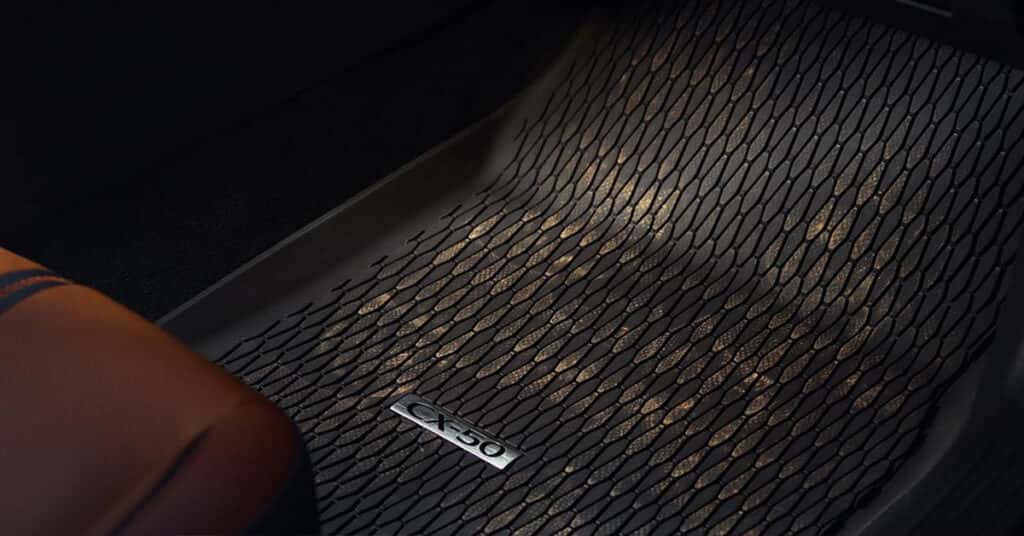 A Mazda parts floormat in a vehicle