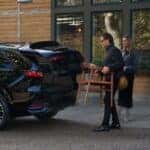 Couple loading chair into 2026 Mazda CX-70 trunk