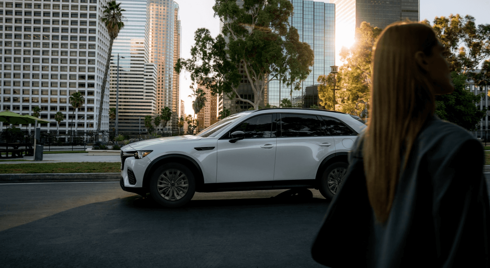 2026 Mazda CX-70 PHEV driving on city street side view