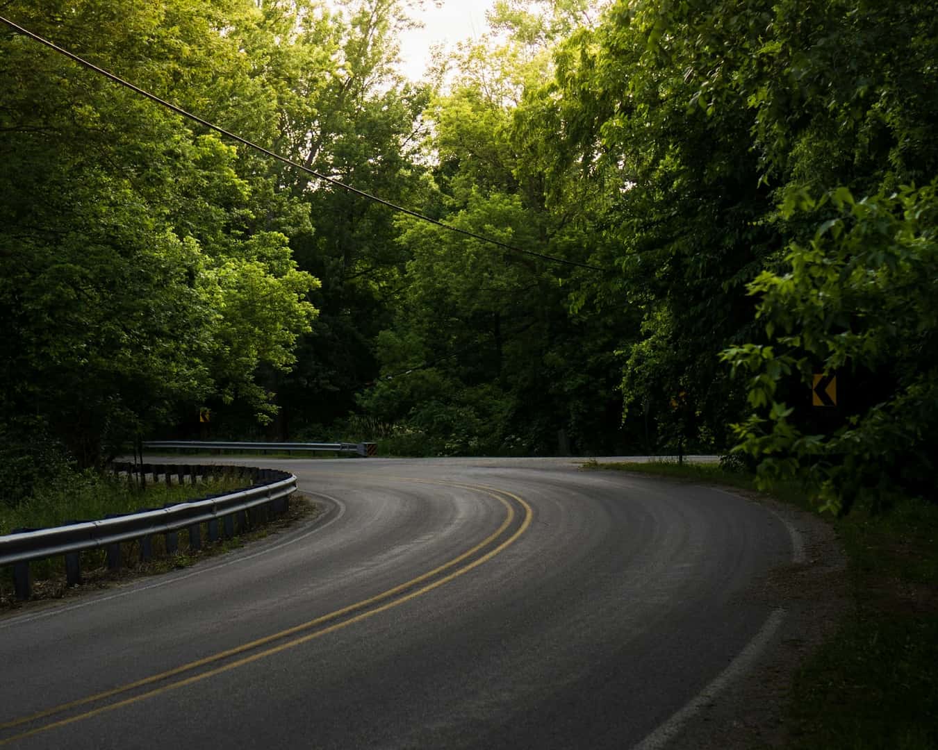 Scenic drive road photo by emmalee-couturier