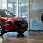 Man walking through Mazda dealership