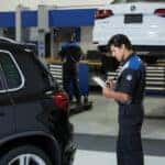 VW tech inspecting SUV