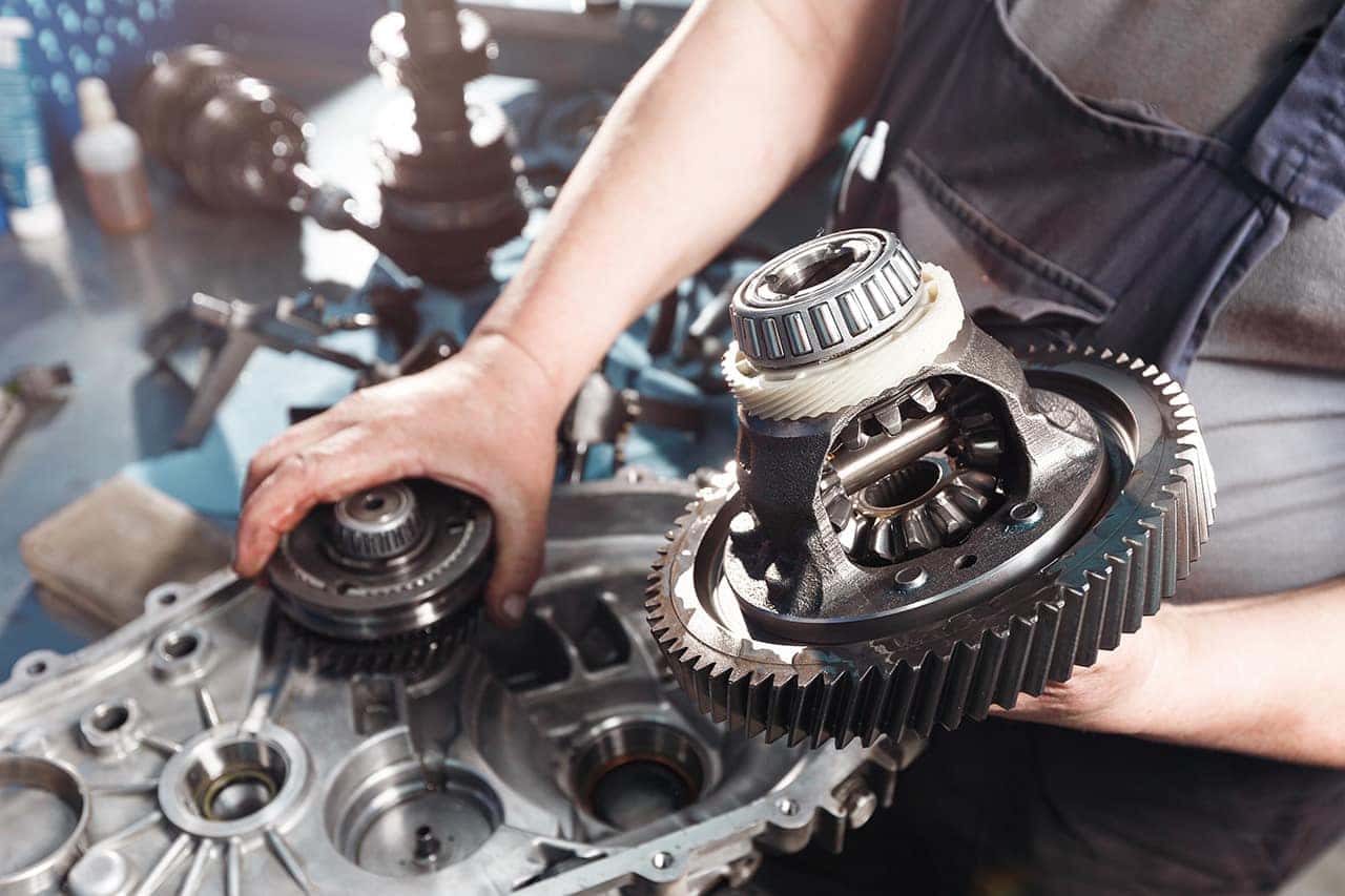 Volkswagen service technician working on a transmission