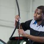 Volkswagen service technician replacing windshield wipers