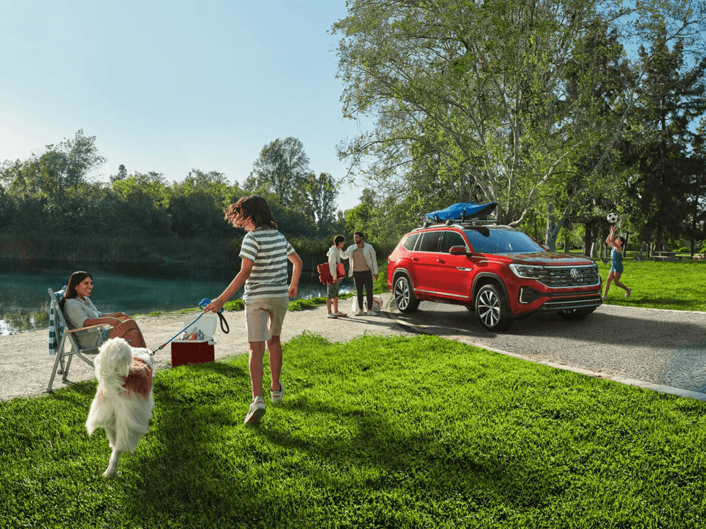 Family walking in front of a vehicle covered by the Volkswagen CPO warranty