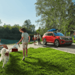 Family walking in front of a vehicle covered by the Volkswagen CPO warranty