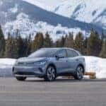 2026 Volkswagen ID.4 parked in front of a snowy mountain
