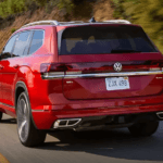 2026 Volkswagen Atlas driving on the highway rear angle