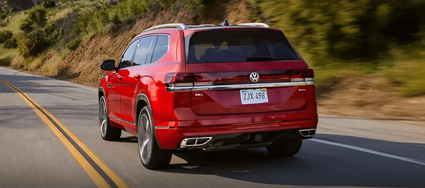 2026 Volkswagen Atlas driving on the highway rear angle