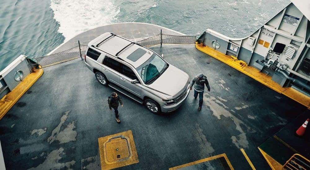A silver 2018 Chevy Tahoe parked on a ferry boat.
