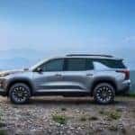 A silver 2024 Chevy Traverse Z71 overlooking mountains.