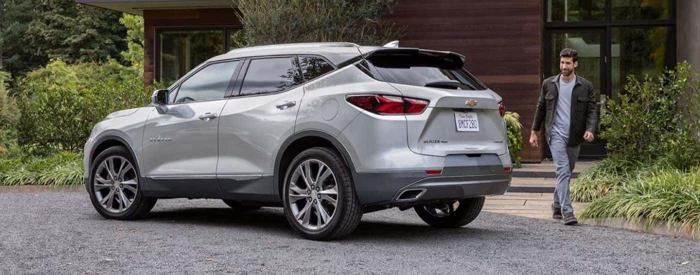 A silver 2022 Chevy Blazer parked on a gravel a driveway.