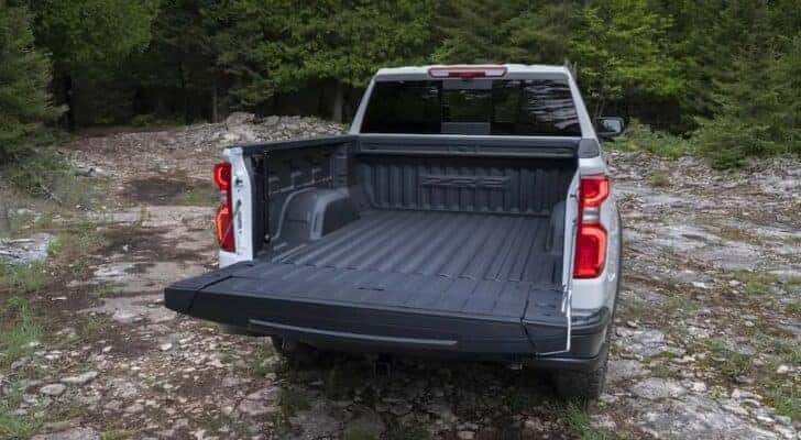 The open tailgate and bed of a white 2024 Chevy Silverado 1500 ZR2