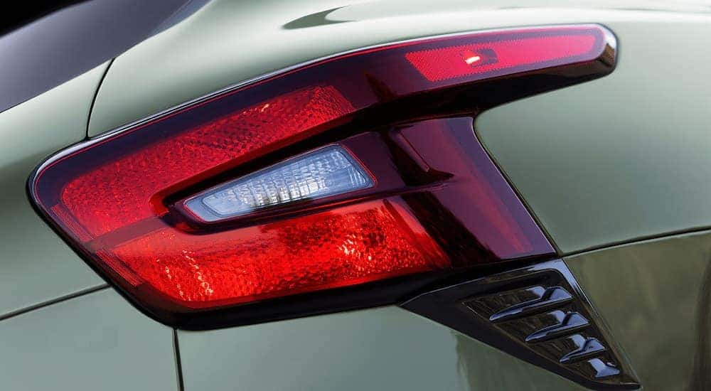 A close up of the brakelight of a green 2025 Chevy Trax ACTIV.
