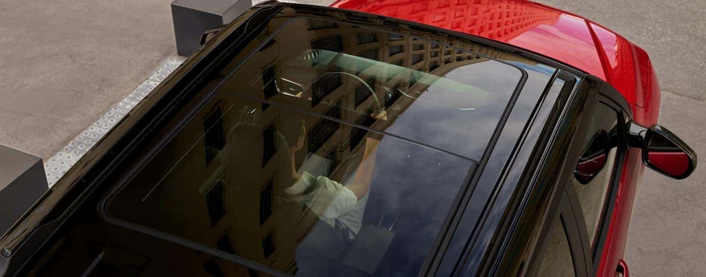 The sunroof on a red 2023 Chevy Trailblazer.