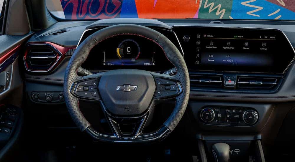 The steering wheel and digital dash in a 2025 Chevy Trailblazer RS for sale.
