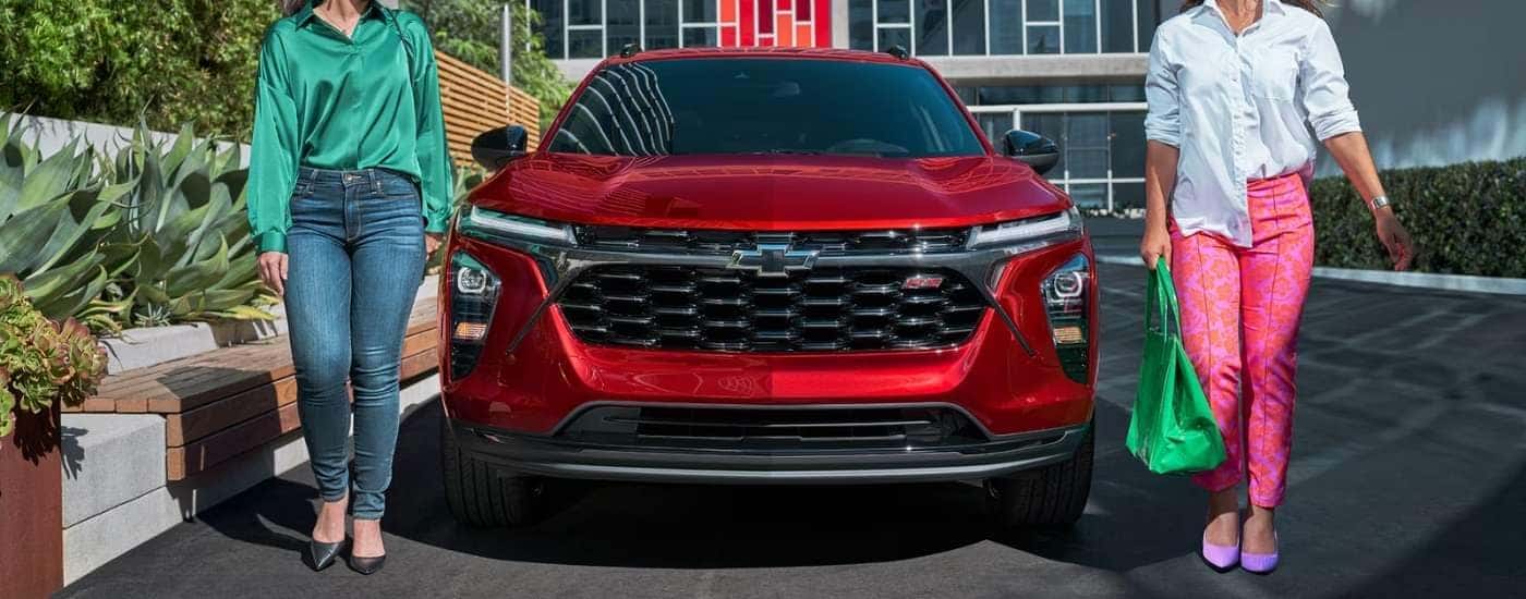 A red 2025 Chevy Trax 2RS for sale near Duncan parked at a dealership.