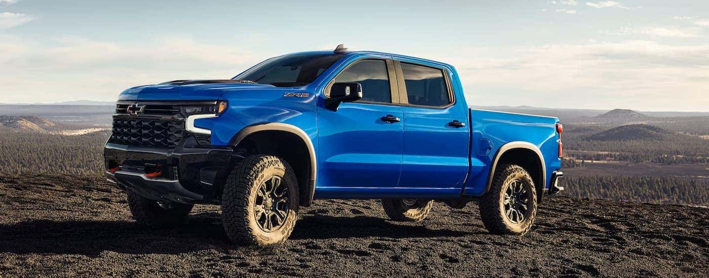 A blue 2025 Chevy Silverado ZR2 parked off-road