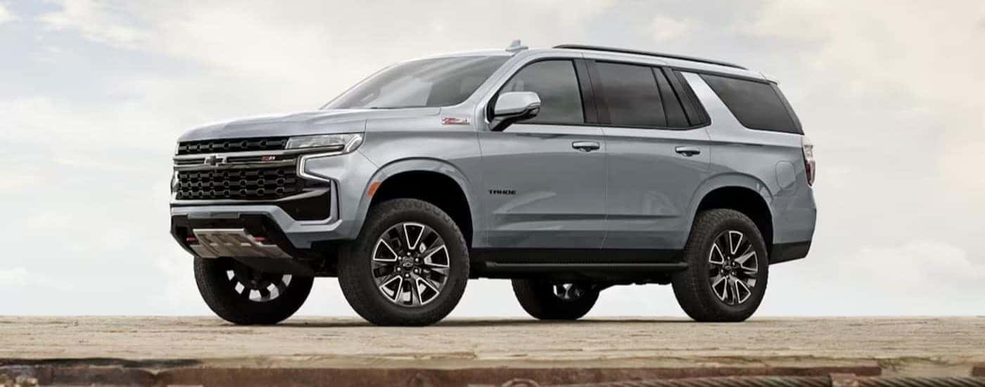 A silver 2024 Chevy Tahoe Z71 parked during the day.