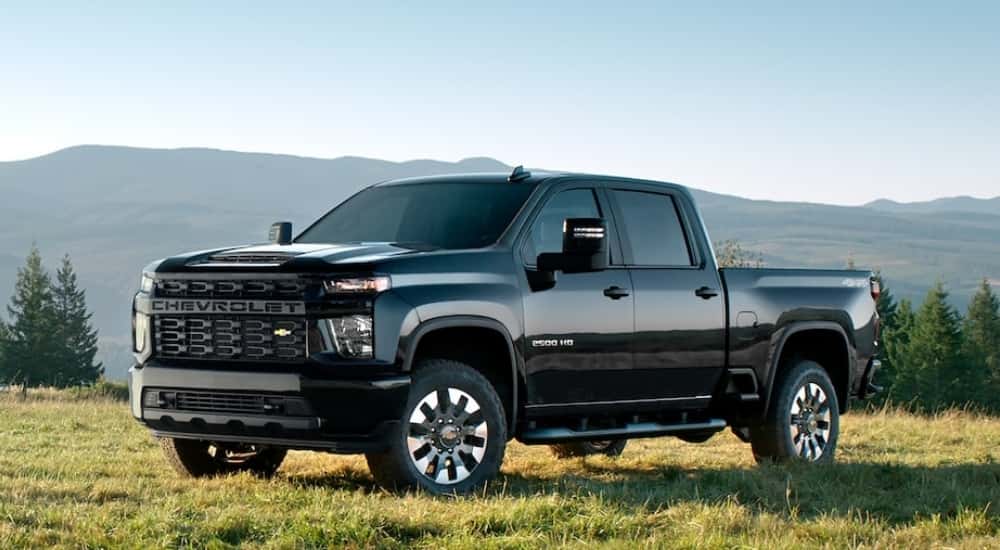 A black 2022 Chevy Silverado 2500 HD parked off-road.
