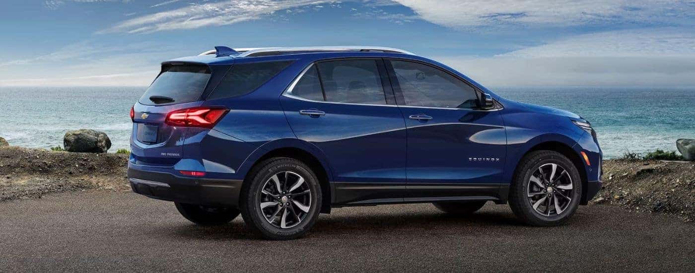 A blue used 2023 Chevy Equinox parked near water