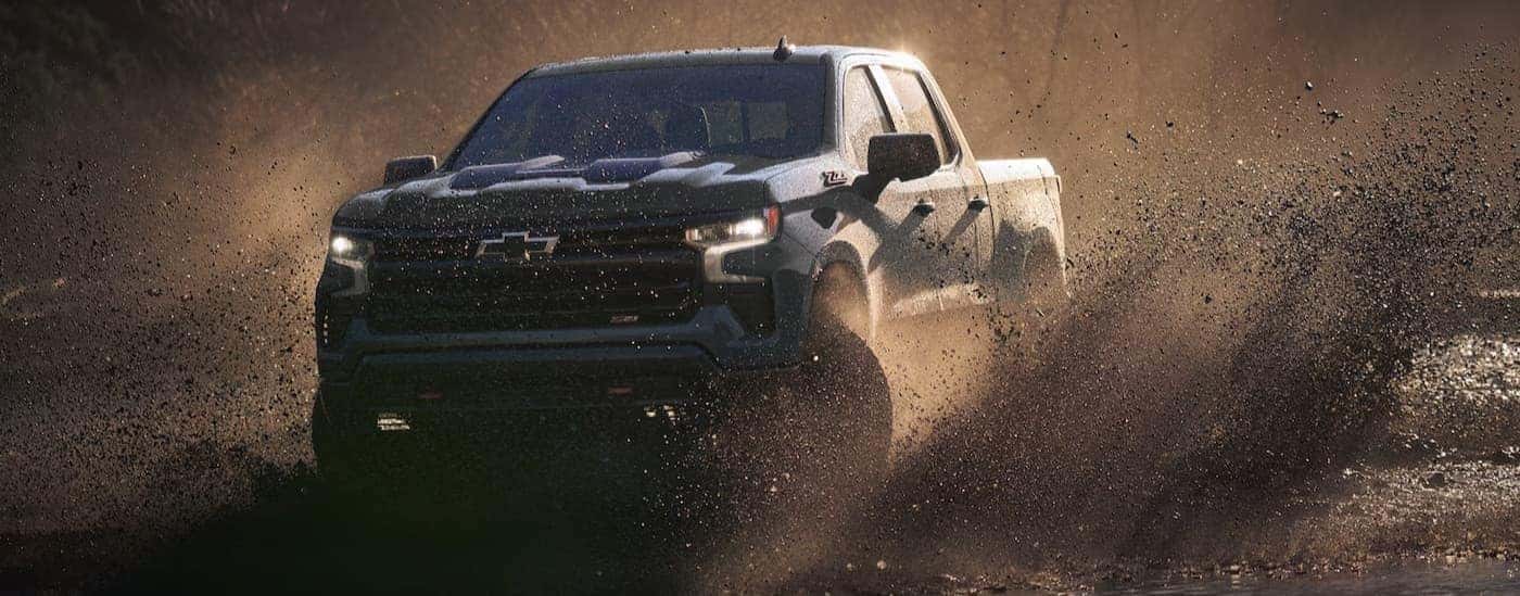 A blue 2026 Chevy Silverado 1500 ZR2 off-roading.