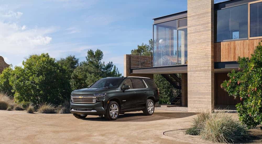 Black 2022 Chevy Tahoe parked outside a home 