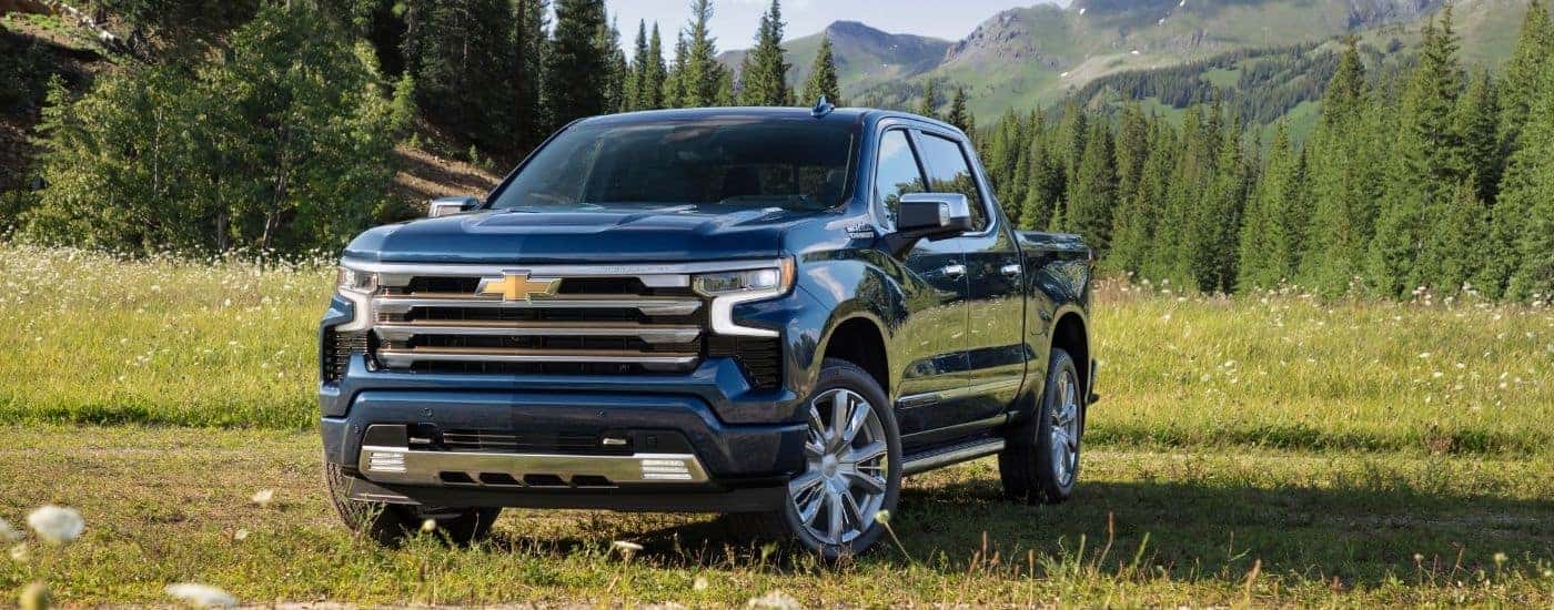 A blue 2024 Chevy Silverado 1500 from the front.