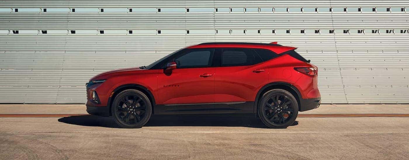 A red 2021 Chevy Blazer from the side.