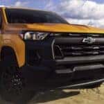 A yellow 2026 Chevy Colorado parked after viewing trucks for sale.