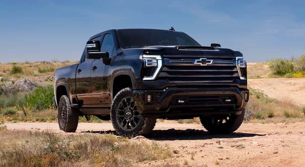 A black 2026 Chevy silverado 2500 HD parked offroad.