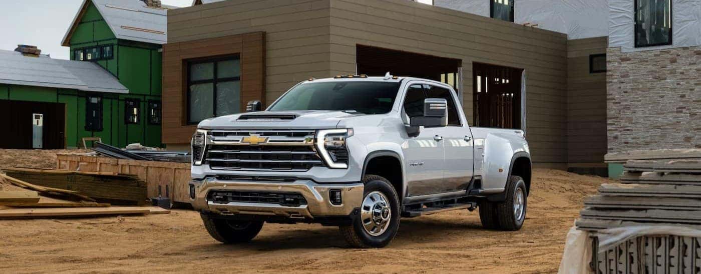 A white 2025 Chevy Silverado 3500 parked on a job site.