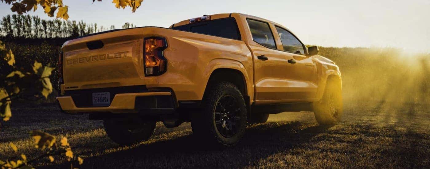 A yellow 2026 Chevy Colorado parked off-road.