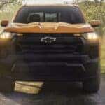 A yellow 2026 Chevy Colorado off-roading.