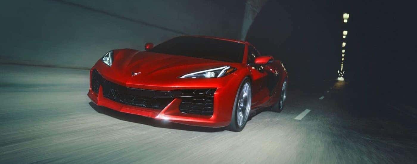 Red 2023 Chevy Corvette Z06 driving through a tunnel