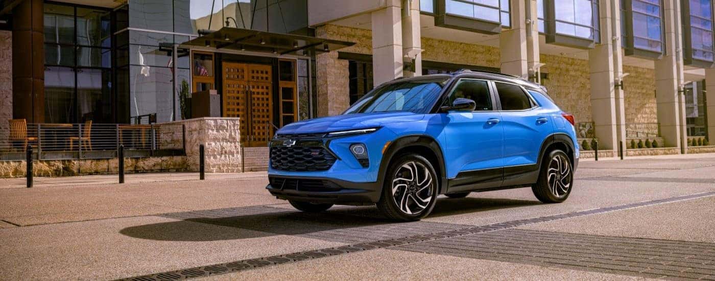 Blue 2024 Chevy Trailblazer RS driving through a city