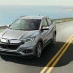 Grey 2022 Honda HR-V driving on a cliffside road