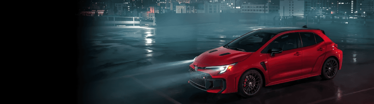 2025 Toyota GR Corolla parked near Cincinnati skyline