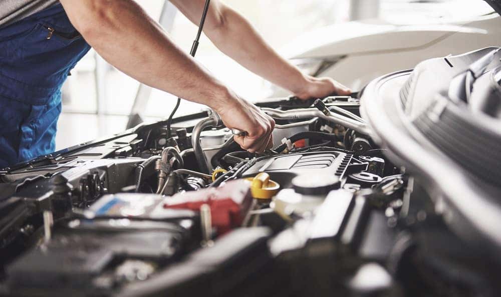 Mechanic Looking over Engine at Service Center
