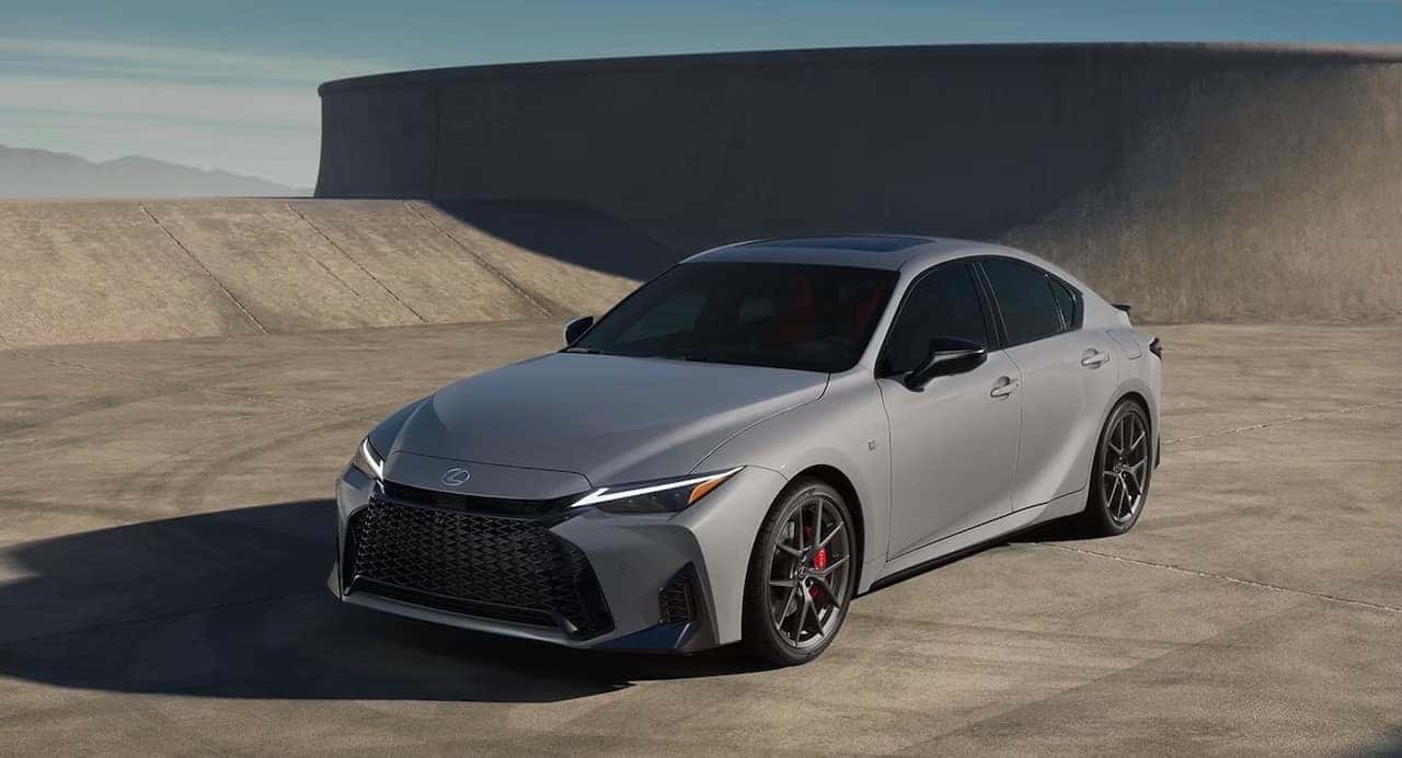 New 2026 Lexus IS exterior driving near Gonzales, LA